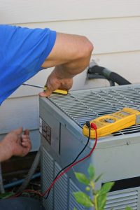 air-conditioner-unit-being-repaired